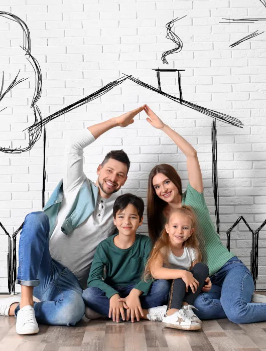 Happy family smiling at home, representing protection with ArcoLife Insurance
